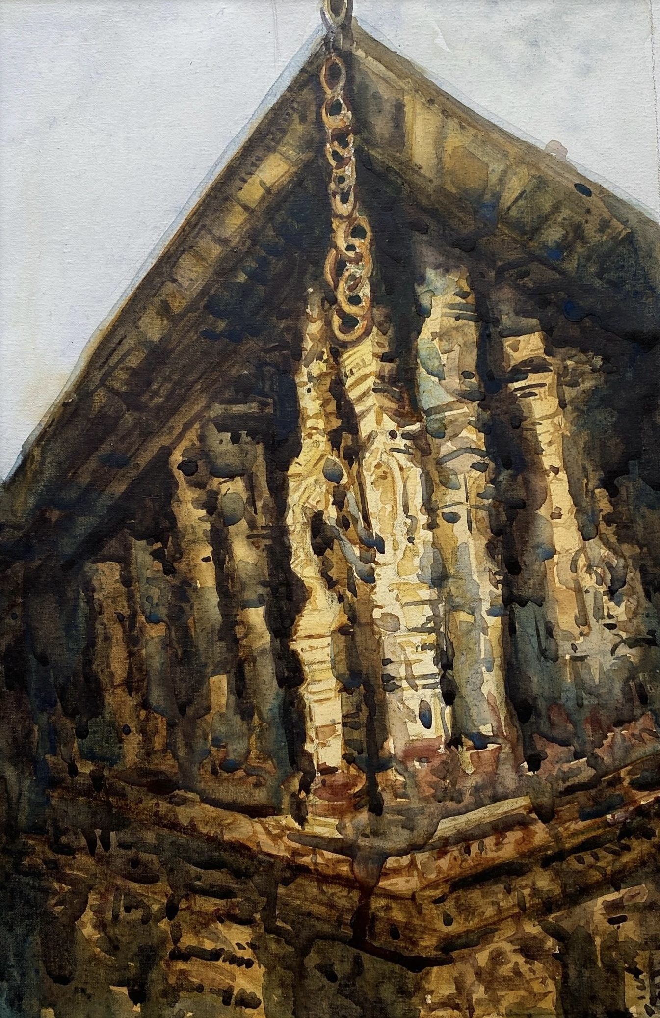 Close-up of a temple roof and hanging chain