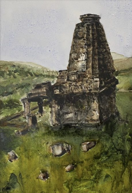 Isolated temple tower in a green field